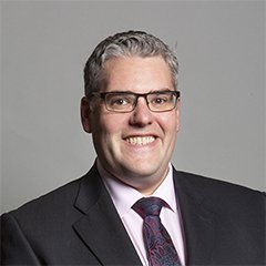 Portrait of Gavin Robinson